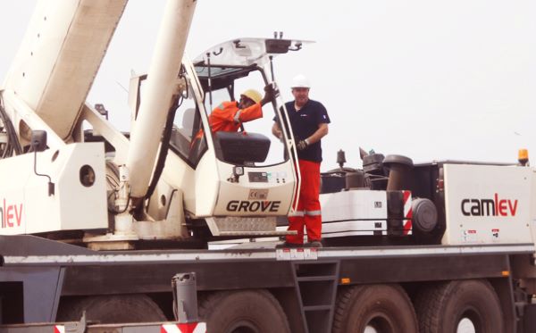 Mobile Crane operator being trained by supervisor