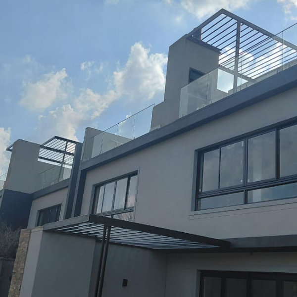 Glass balustrade with steel pergolas