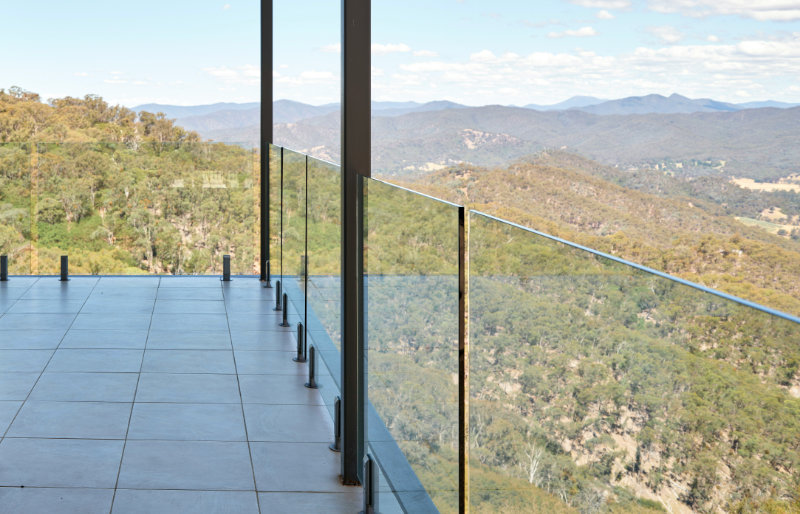 Frameless glass balustrtade installation overlooking beautiful mountainous view