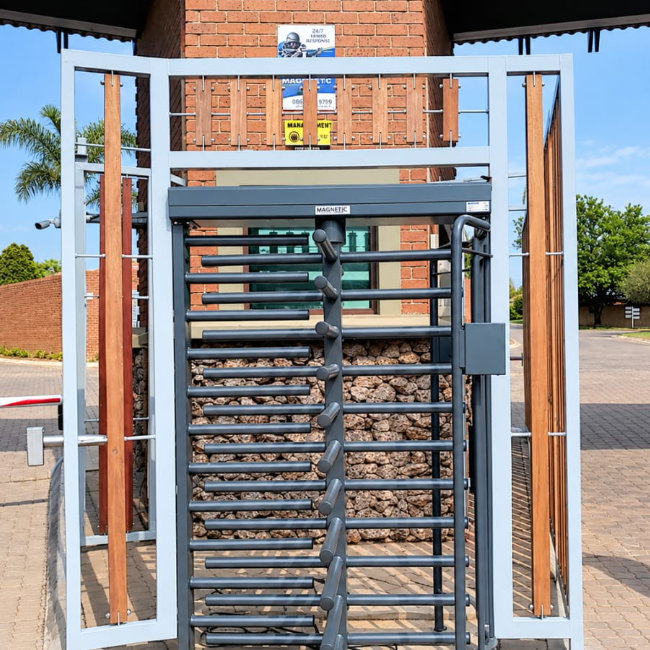 A revolving security gate for a complex