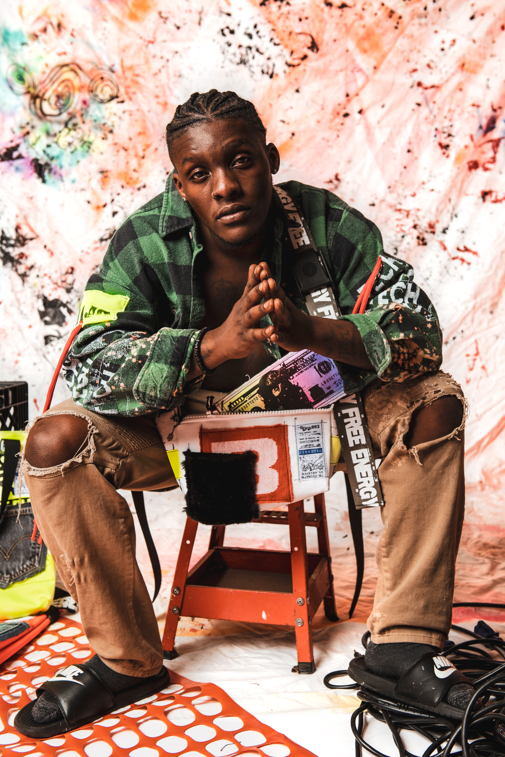 Model wearing REAL100TECH brand clothing.