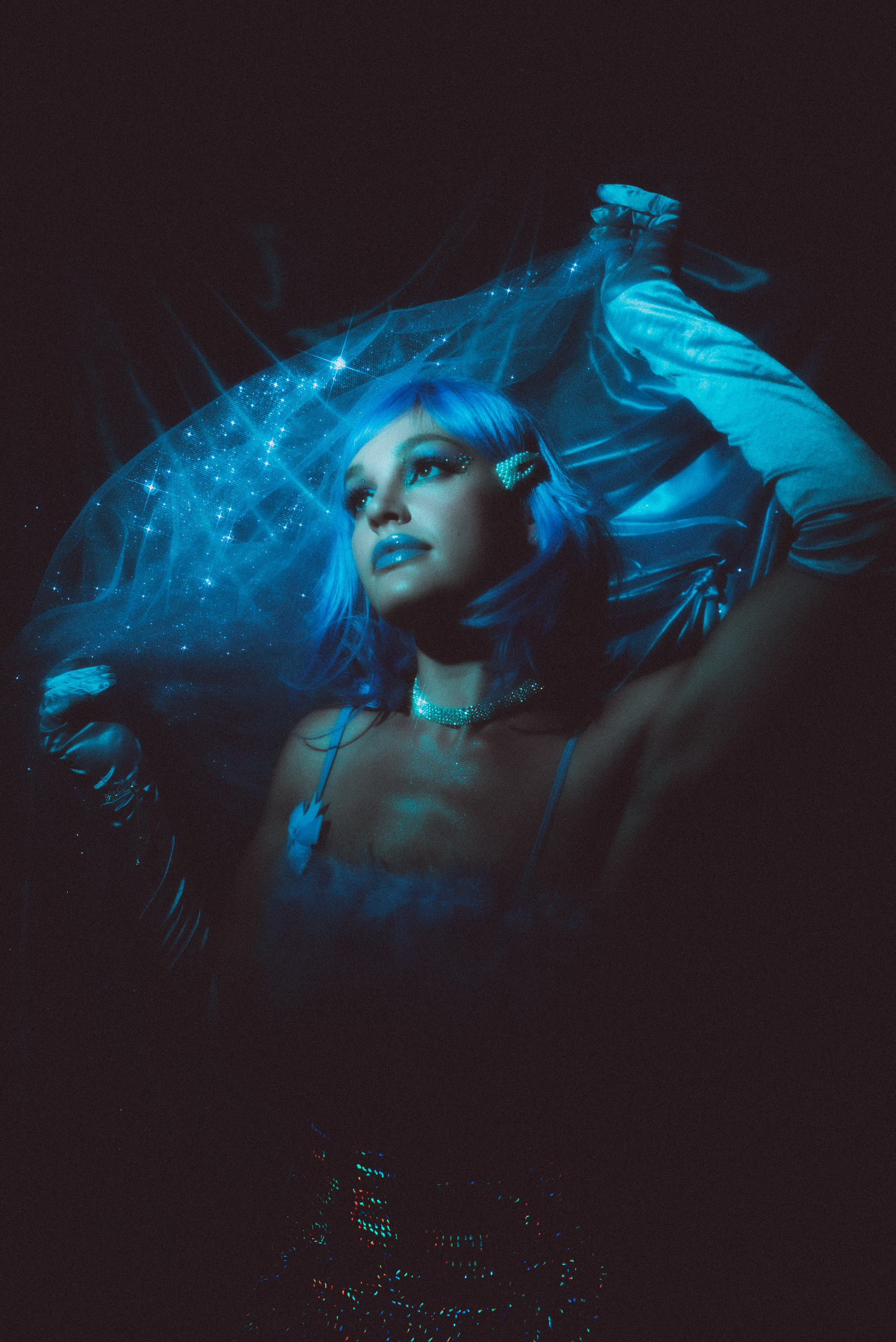 Nico Marie photographed under a soft blue light. 