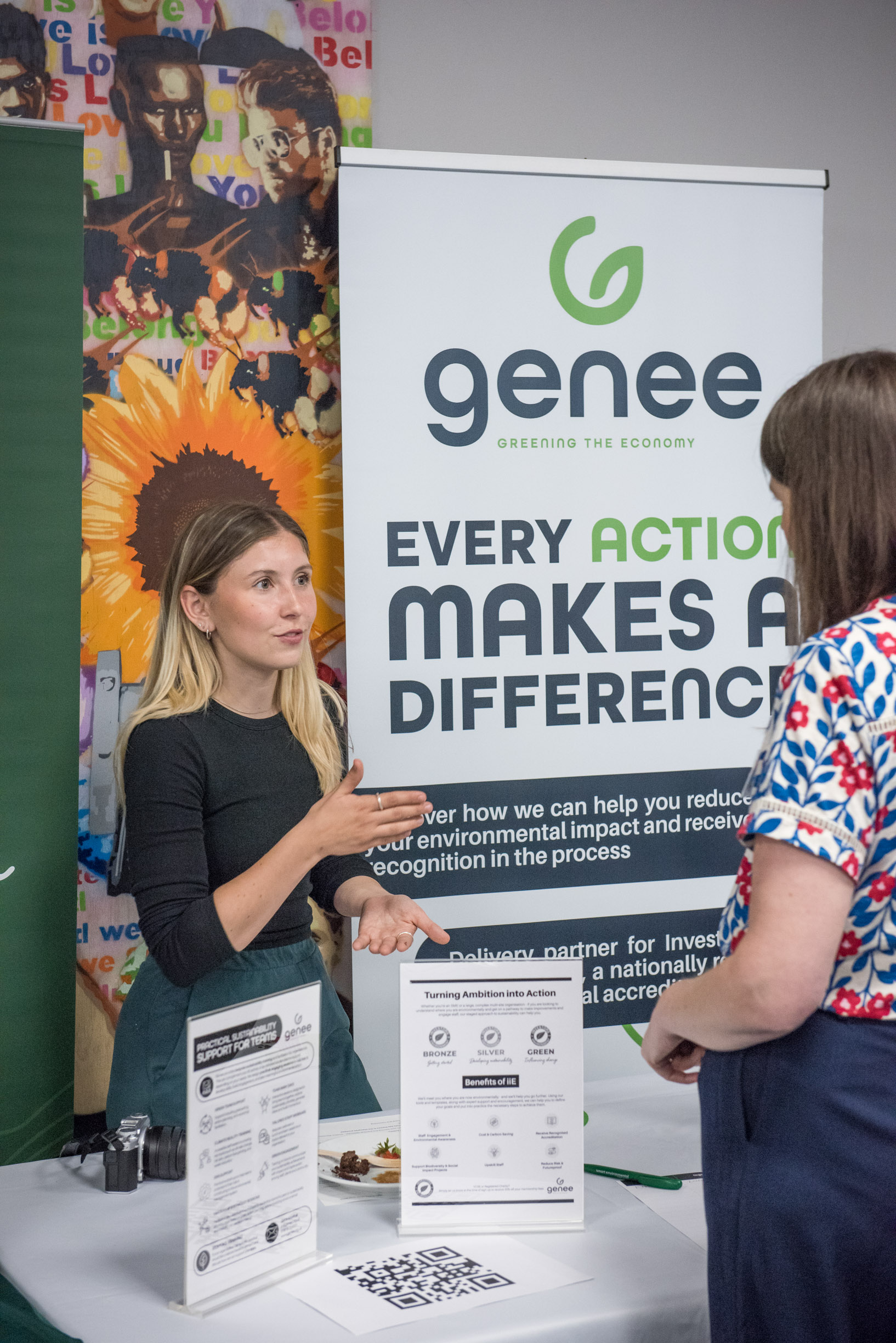 Two Genee consultants standing at Genee stall