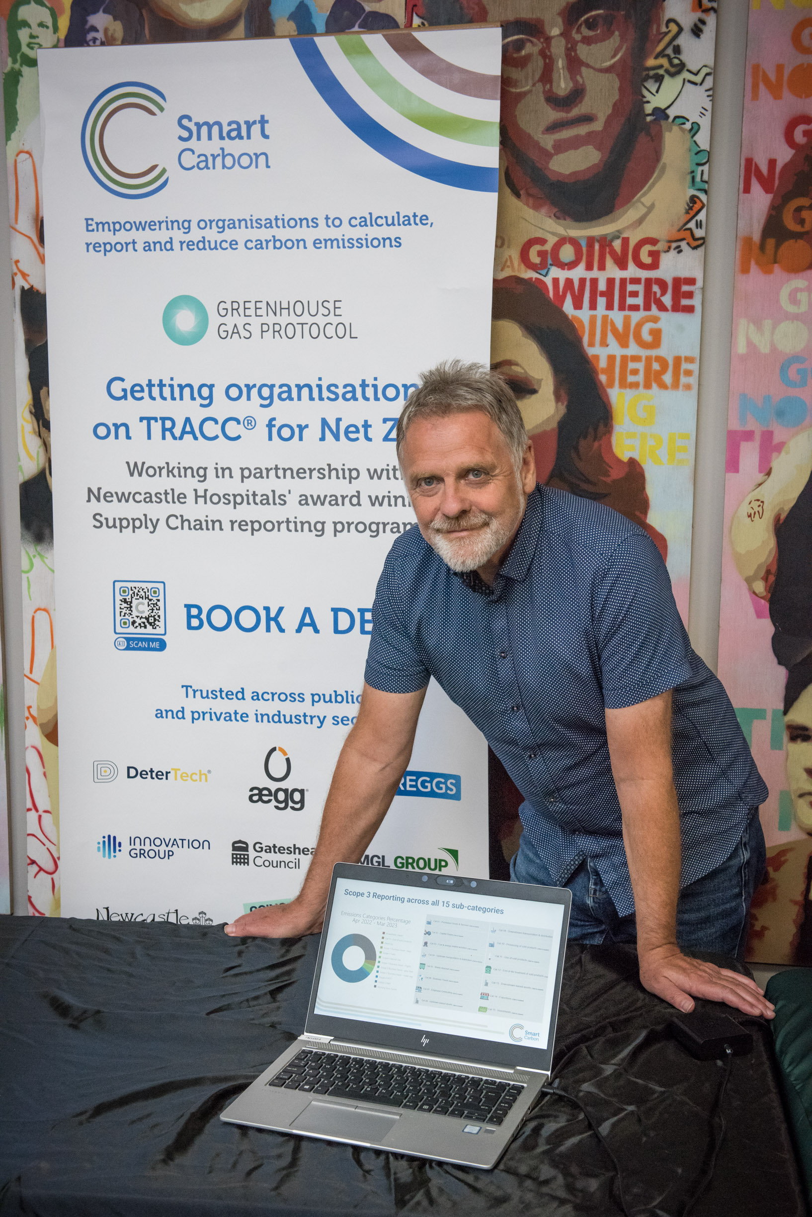 Director of SmartCarbon standing at a SmartCarbon stall