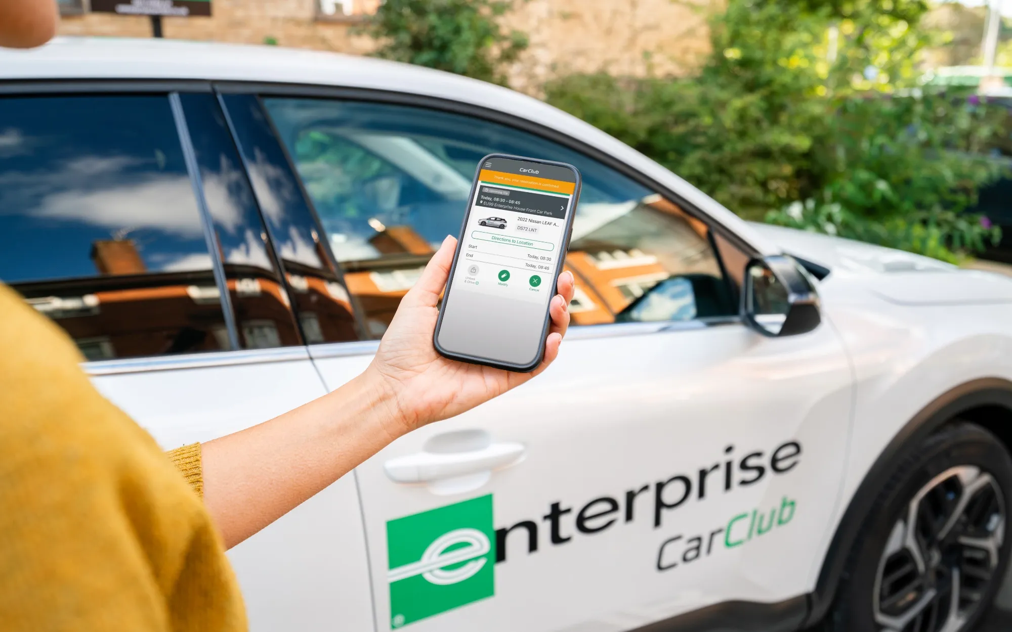 Enterprise Car Club vehicle being booked on phone