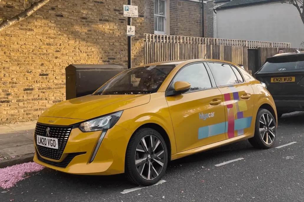 Mustart coloured Hiyacar vehicle parked in London