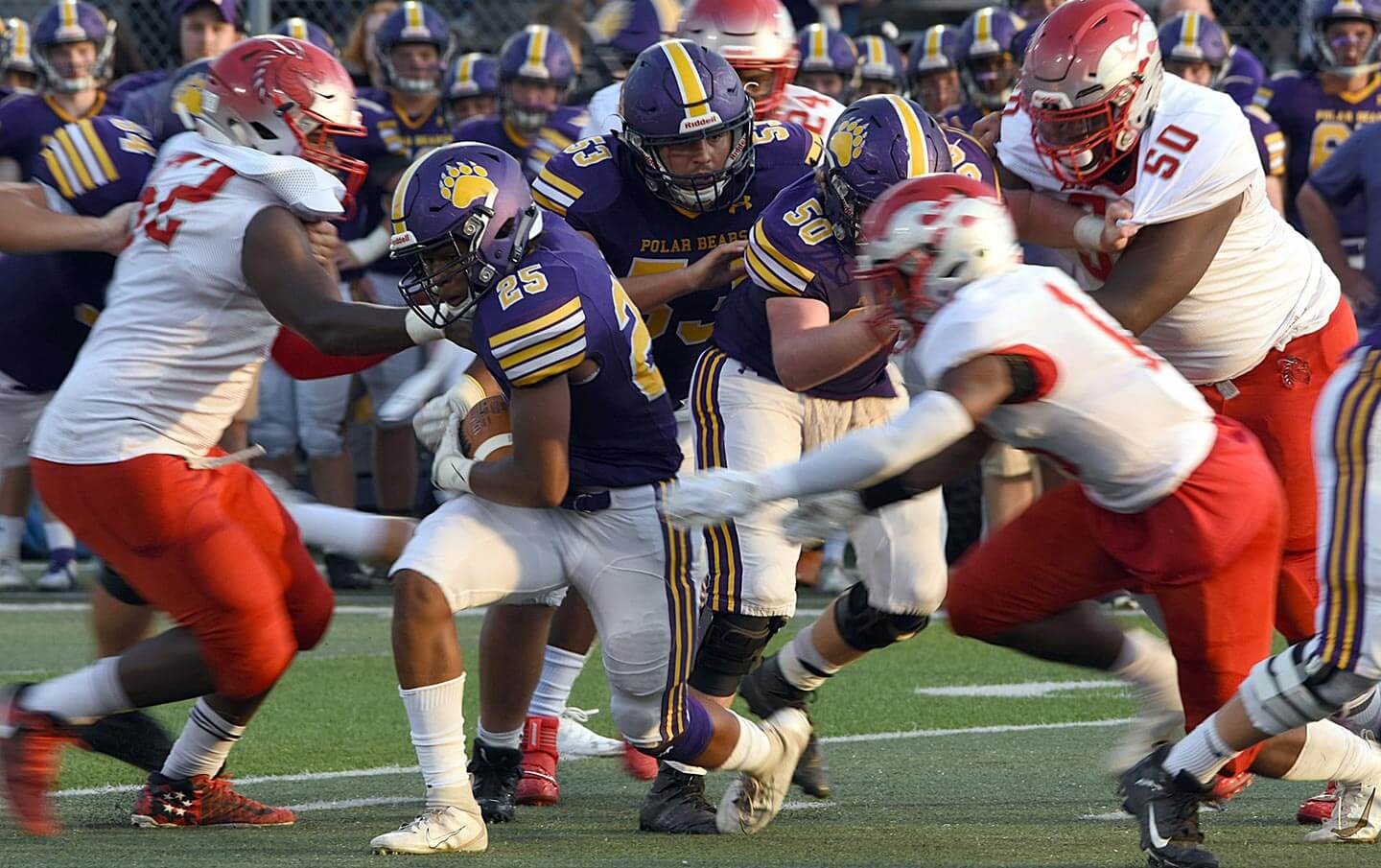 An American Football game mid-play