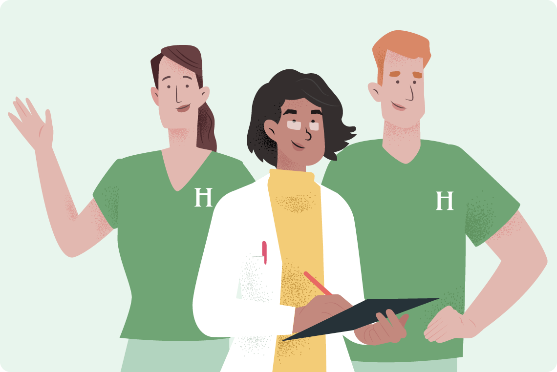 Three healthcare workers in green shirts, smiling and collaborating