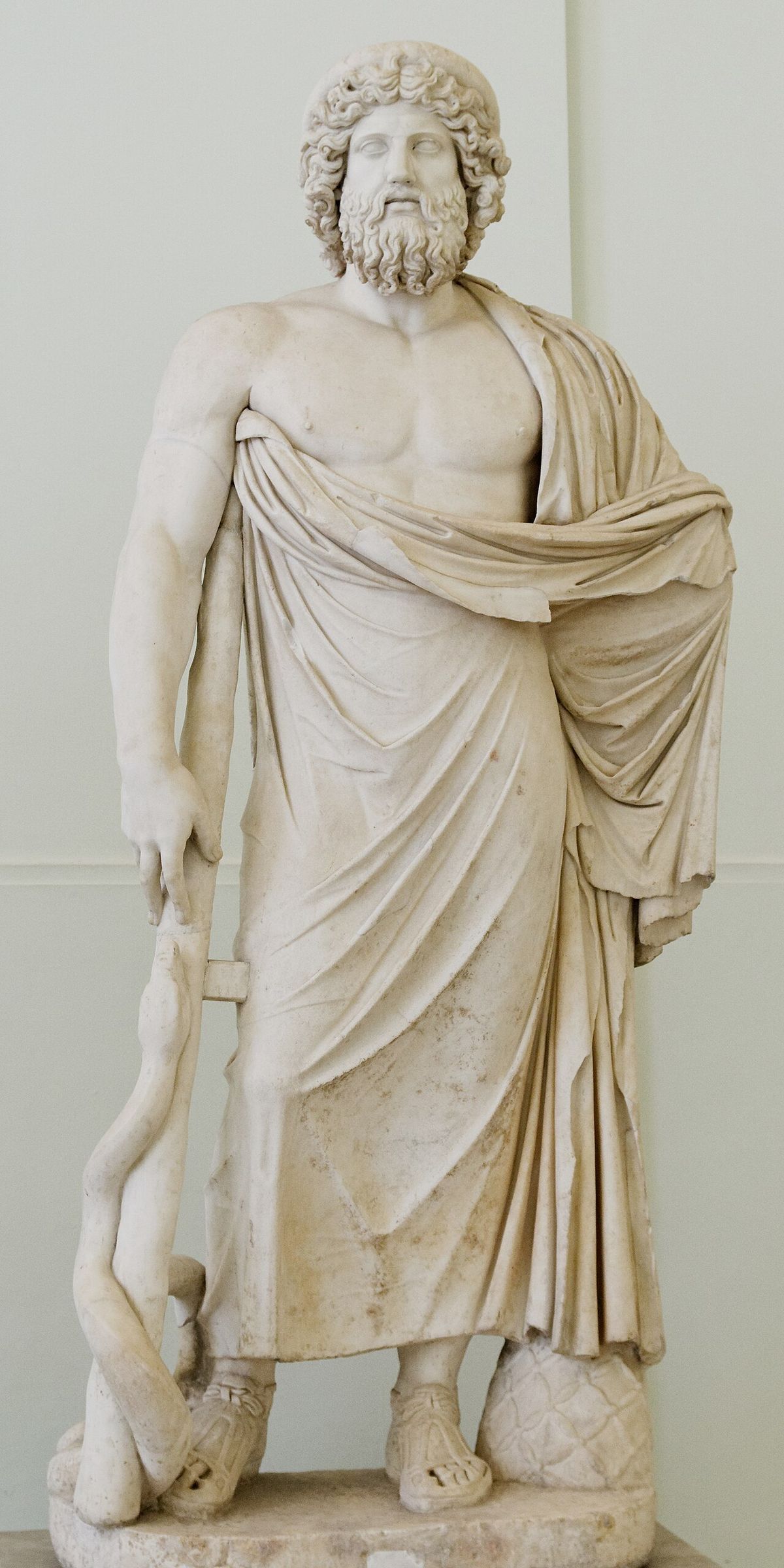 Marble statue of Asclepius of the Giustini type, leaning on a staff entwined by a serpent