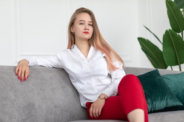 Arrogant looking lady sitting in a sofa
