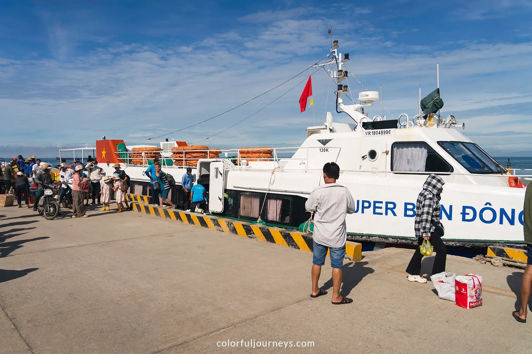 People board a ferry at Ly Son Island, Vietnam