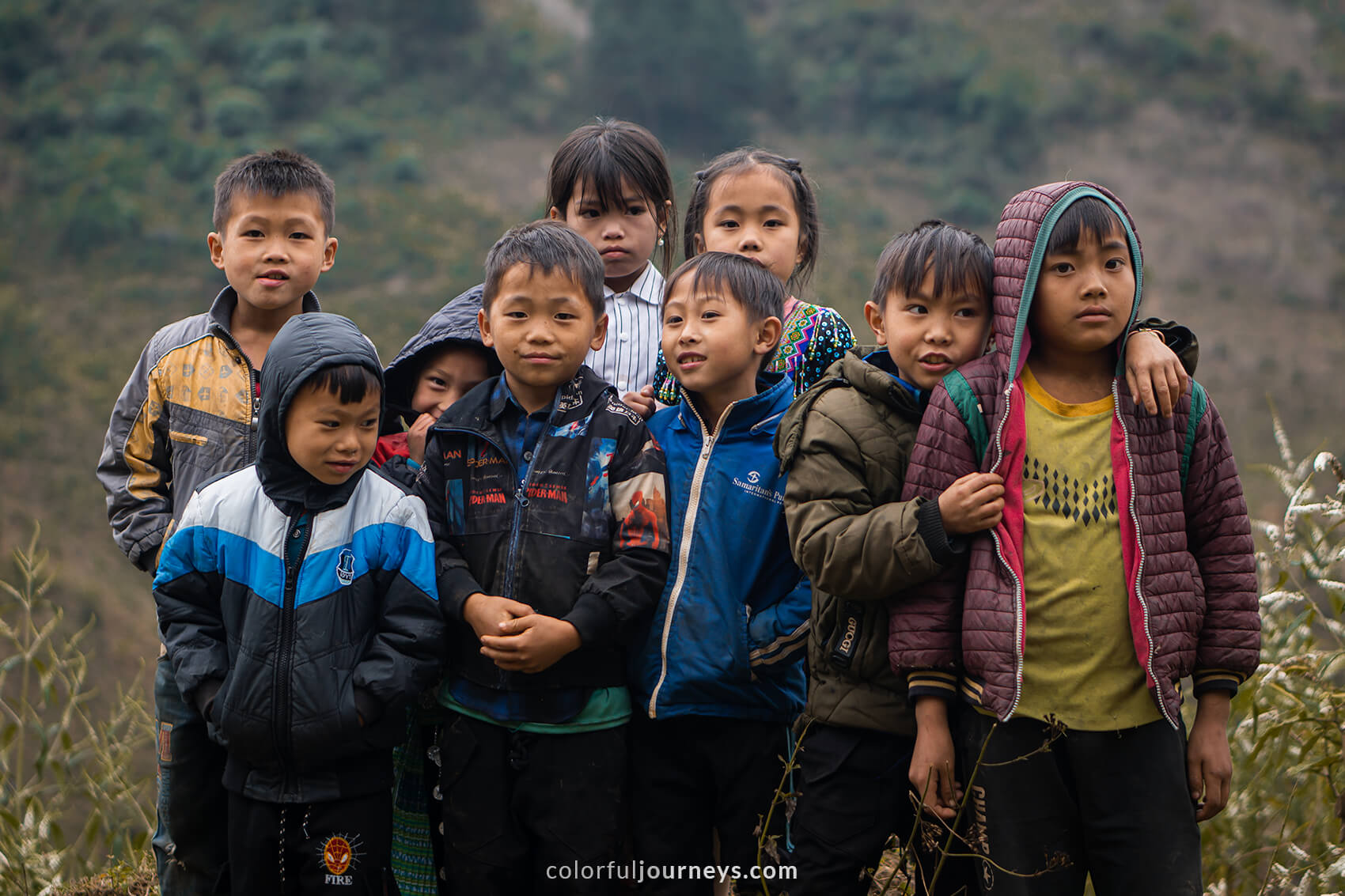 A group of young kids pose for a photo in Northern Vietnam. 