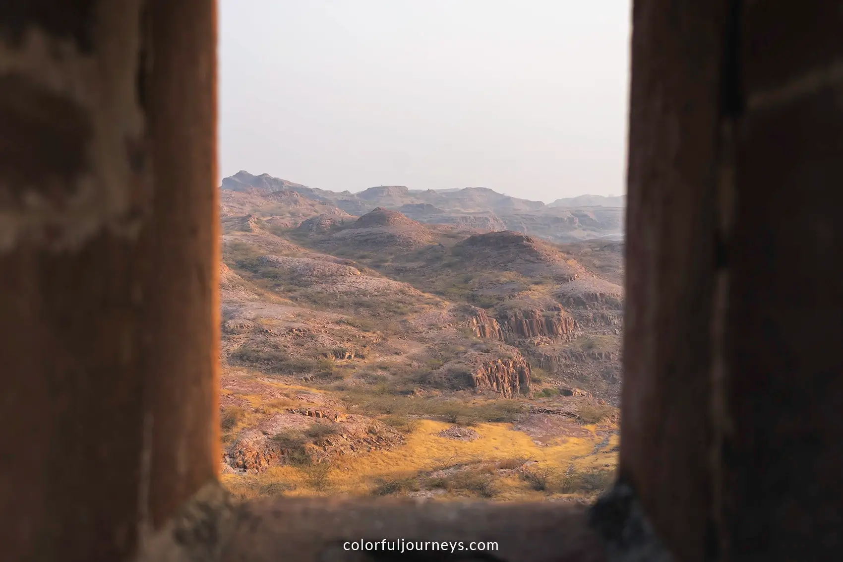 Rao Jodha rock park seen through a city wall in Jodhpur, India