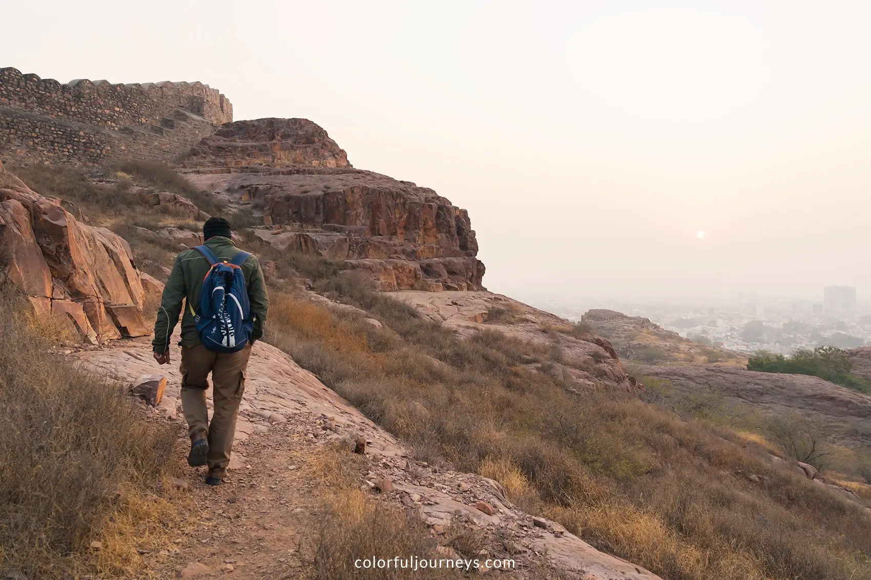 A local guide walks through Rao Jodha rock park in Jodhpur, India