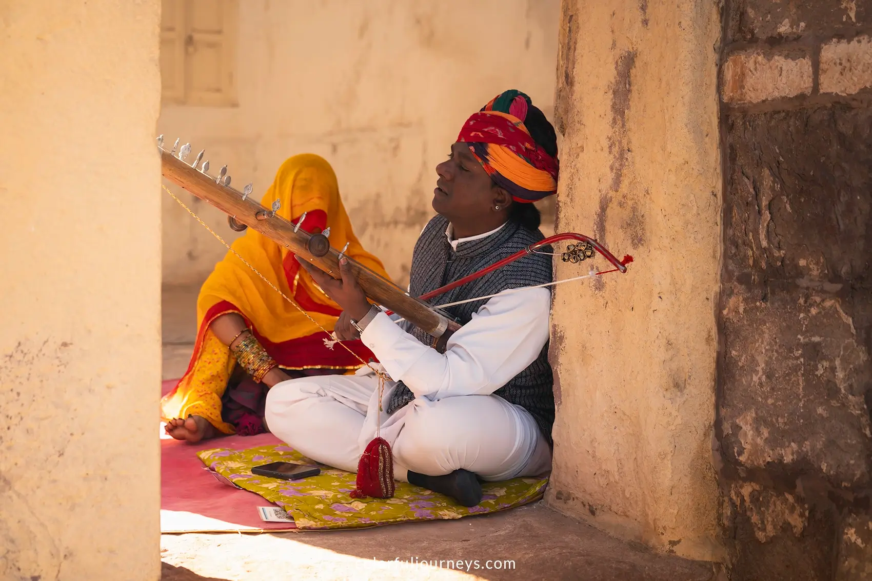 A man plays a traditional instrument at Mehrangarh Fort in Jodhpur, India