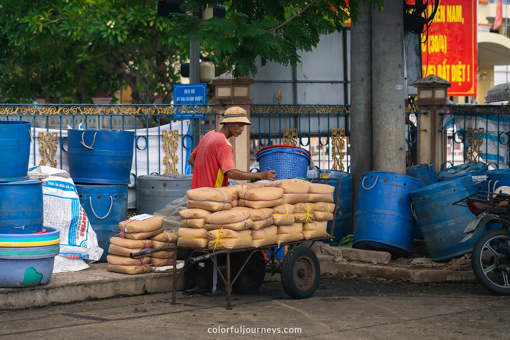 A man loads a cart in Vinh Long, Vietnam