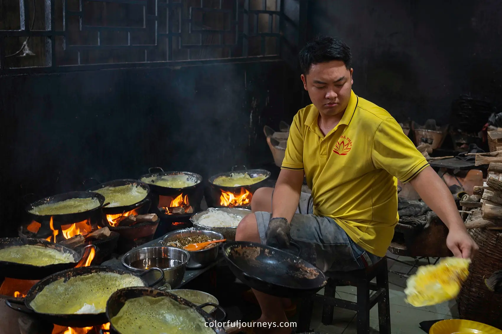 A man prepares Vietnamese Pancakes at a temple in An Giang