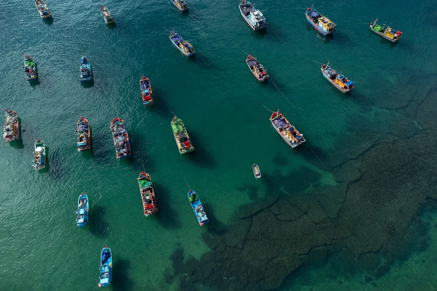 Fishing boats lay in the water near Xuan Hai, Vietnam