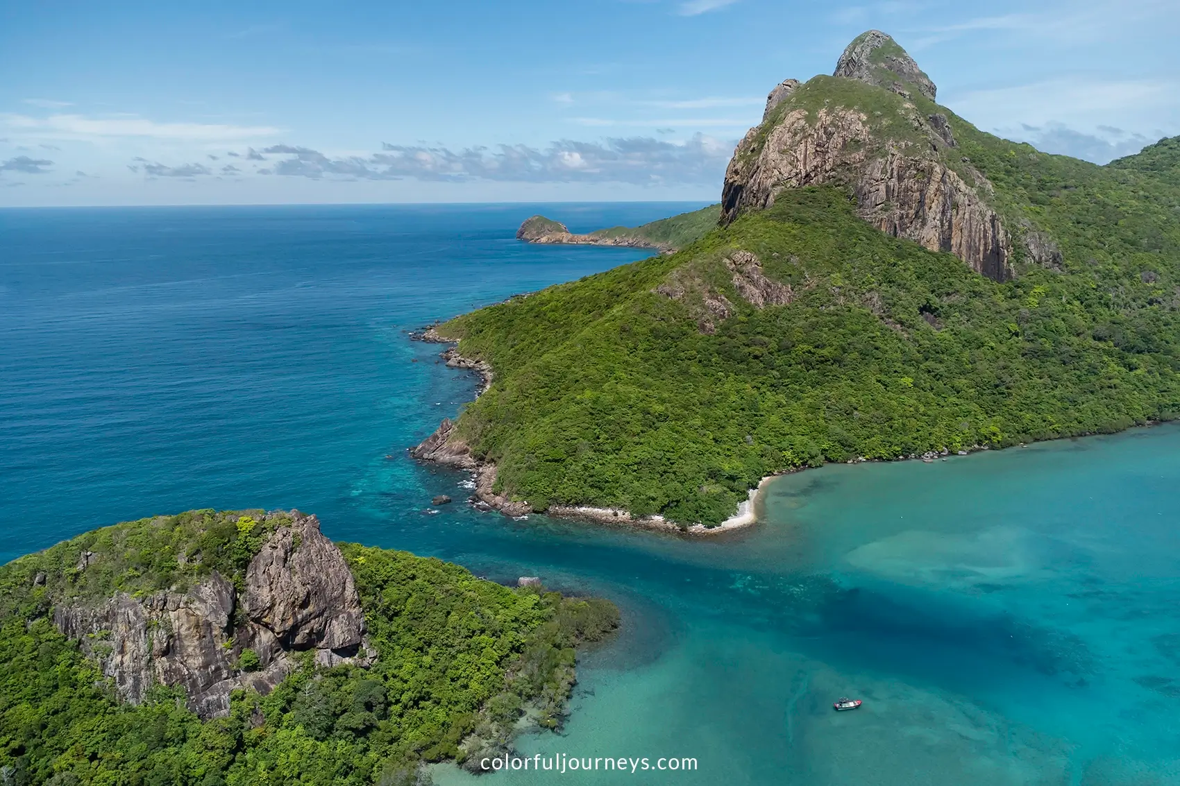 Rock formations and blue water at Con Dao Island, Vietnam