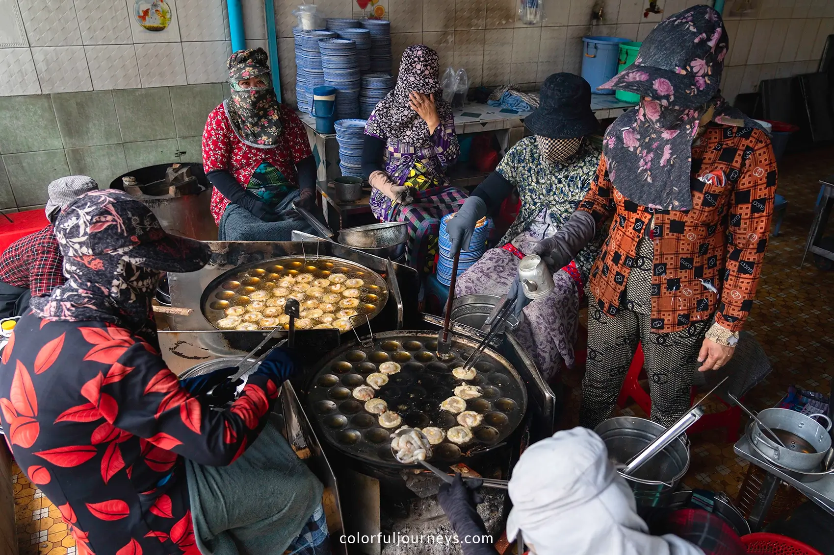 Women prepare banh khot in Vung Tau, Vietnam