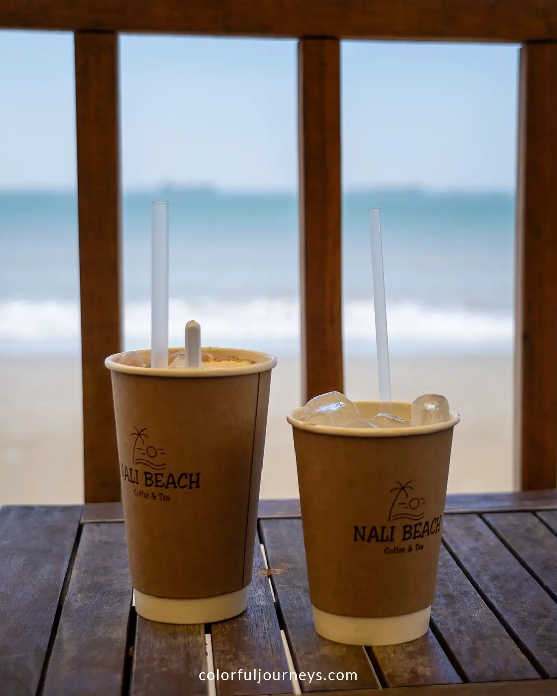 Paper cups with coffee at a cafe