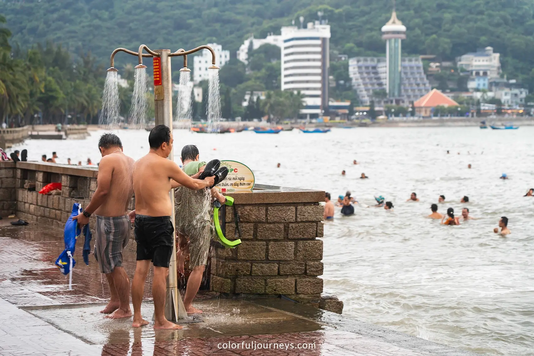 People swim along the coast of Vung Tau, Vietnam