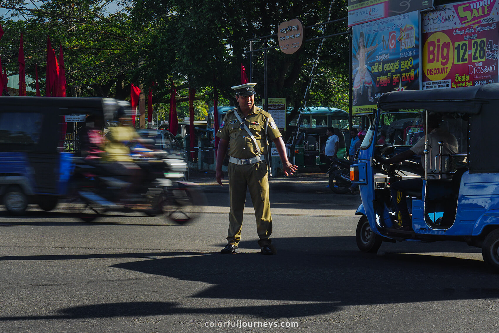A traffic officer controls traffic in Matara, Sri Lanka.