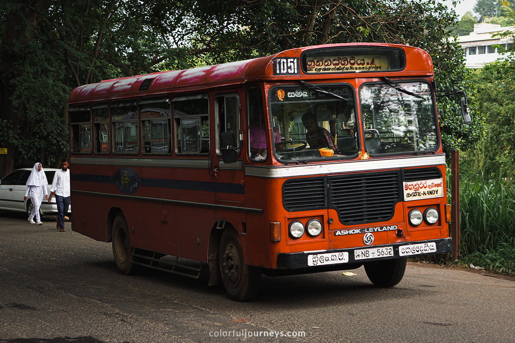 A red bus in Kandy, Sri Lanka.