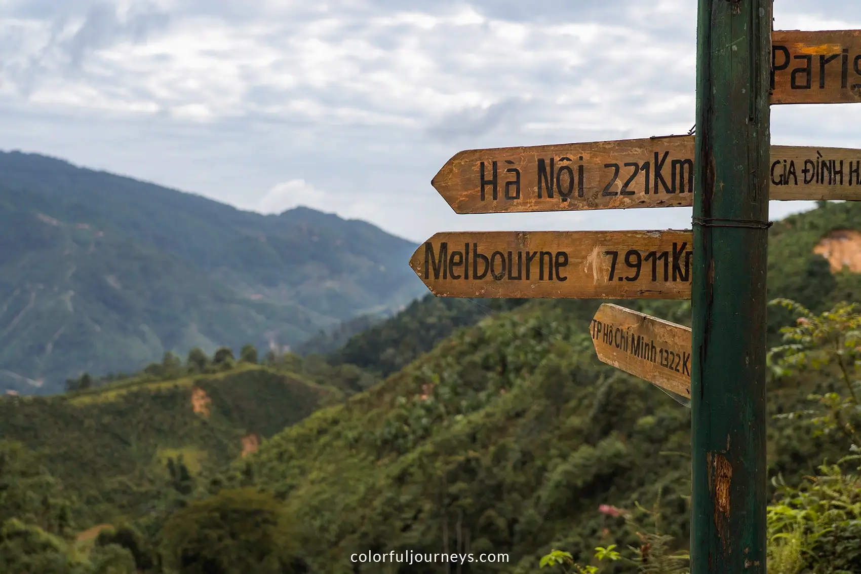 A wooden pole with signs in Ban Lien, Vietnam