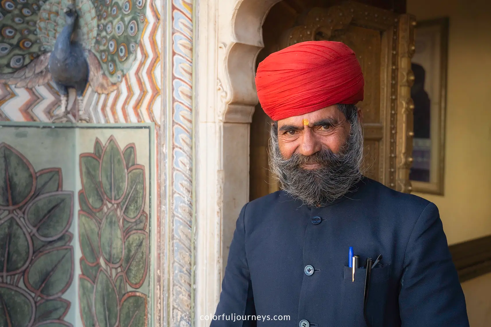 A guard with a red turban at the Royal Palace in Jaipur, india