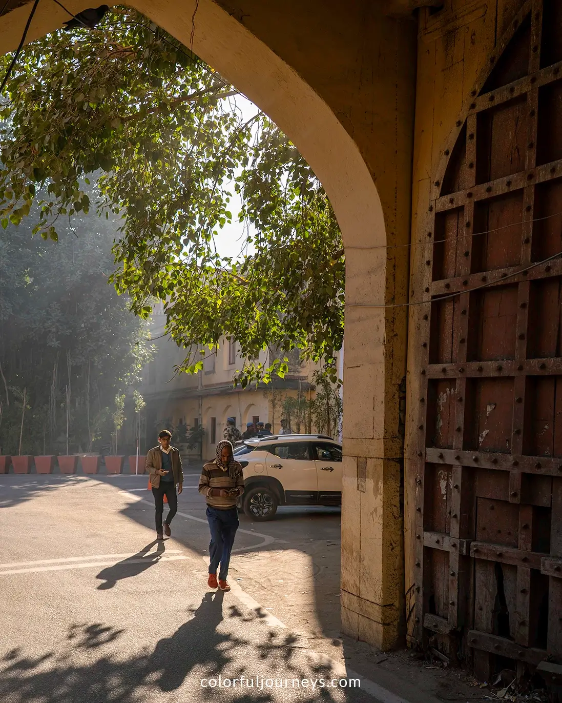 Men walk through a gate in Jaipur, India