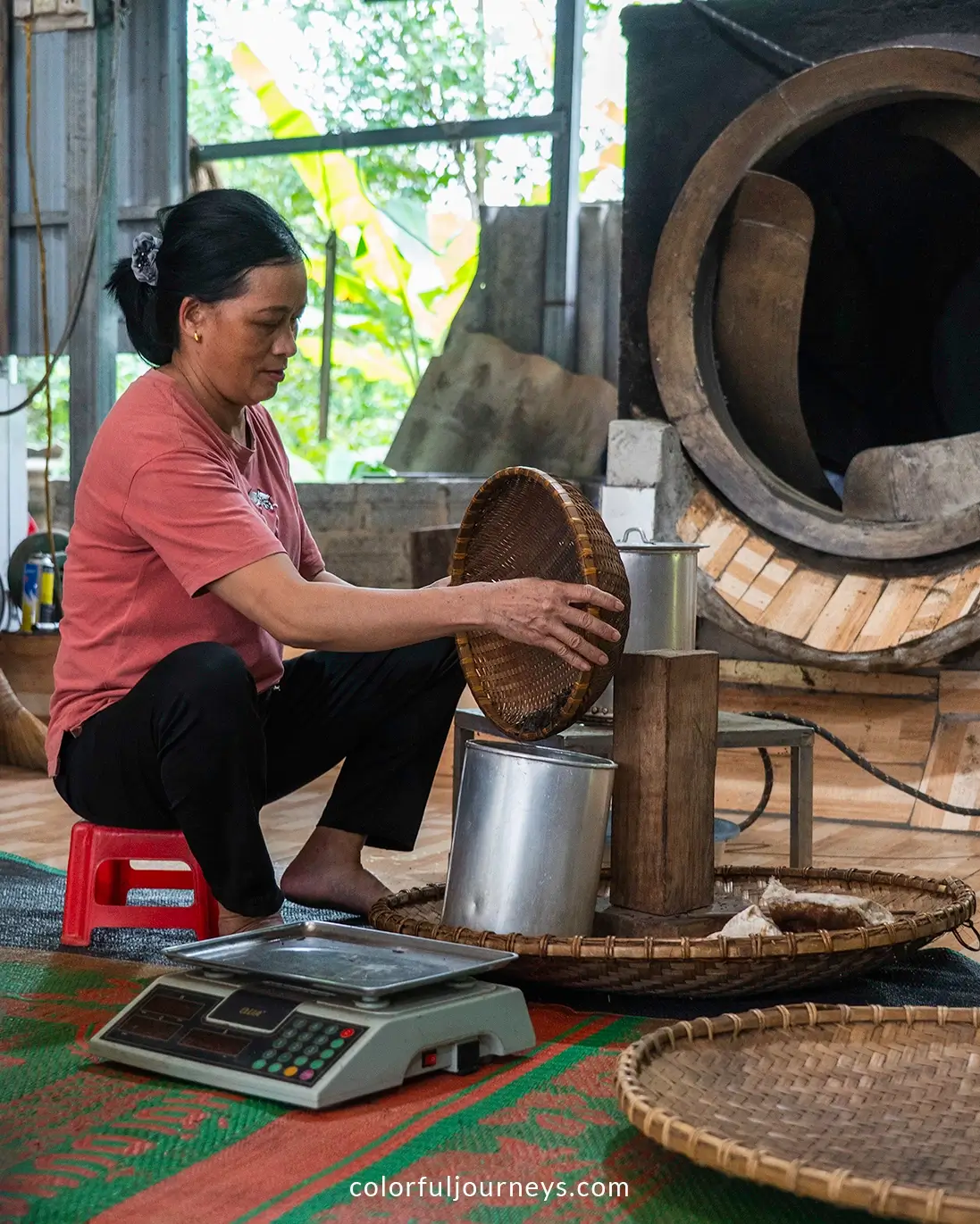 A woman makes a tea cake in Ha Giang, Vietnam