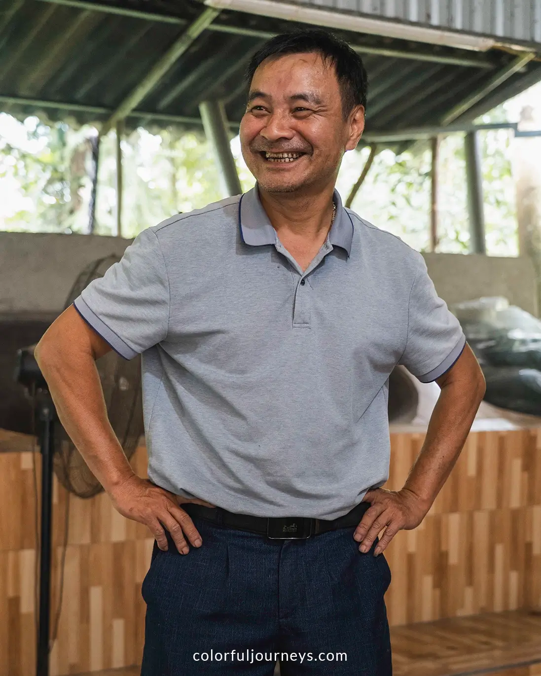 A man smiles at the camera in Ha Giang, Vietnam