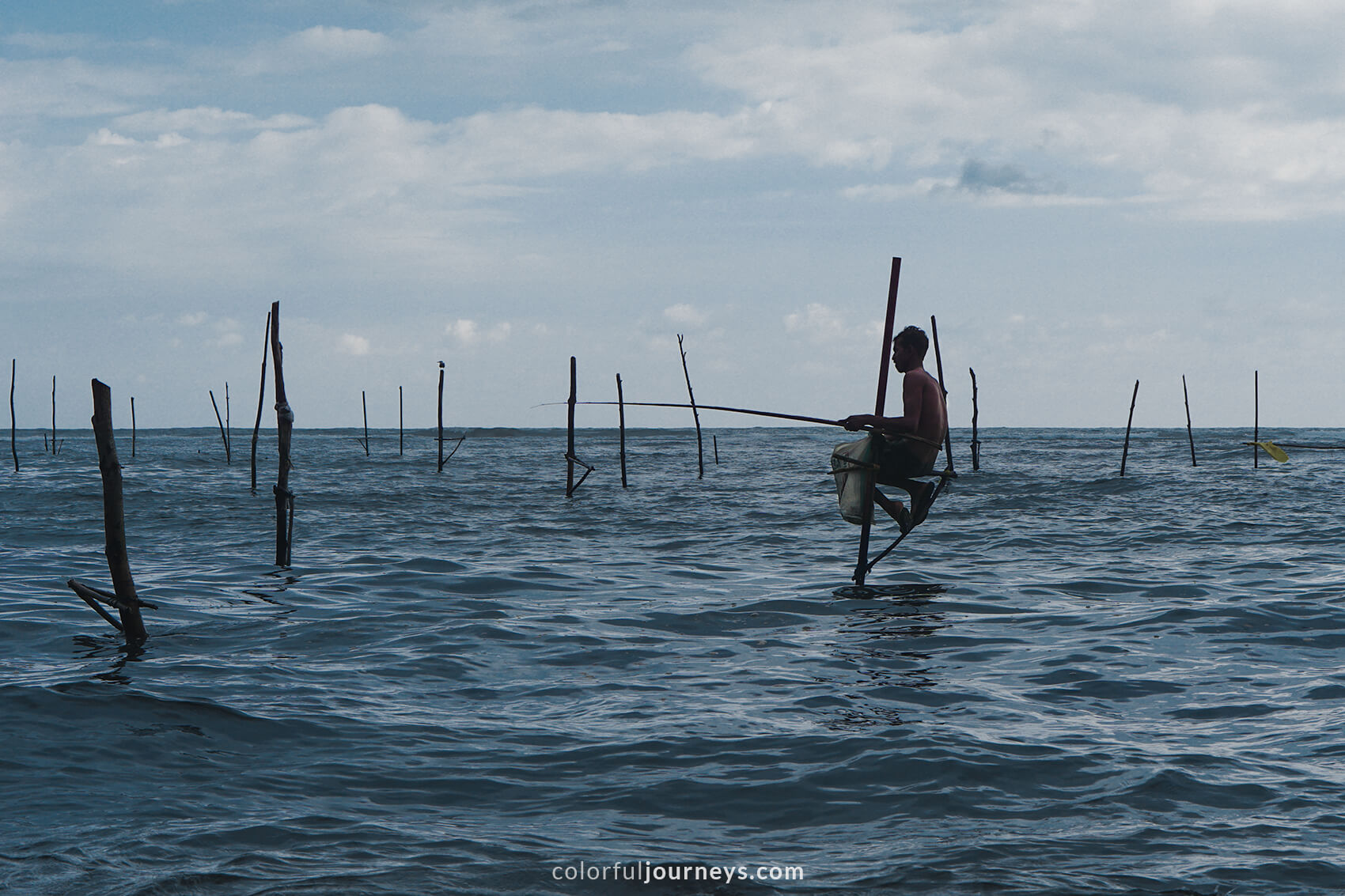 A stilt fisher in Matara, Sri Lanka.