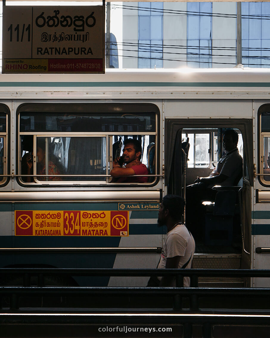 Commuters wait for a bus to depart in Matara, Sri Lanka