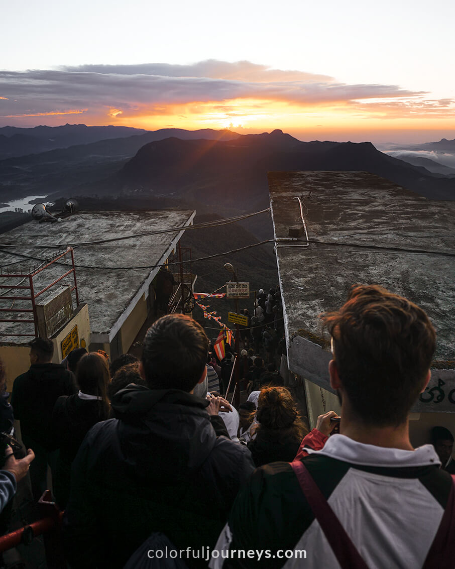 Crowds enjoy the sunrise at the summit of Adam's Peak