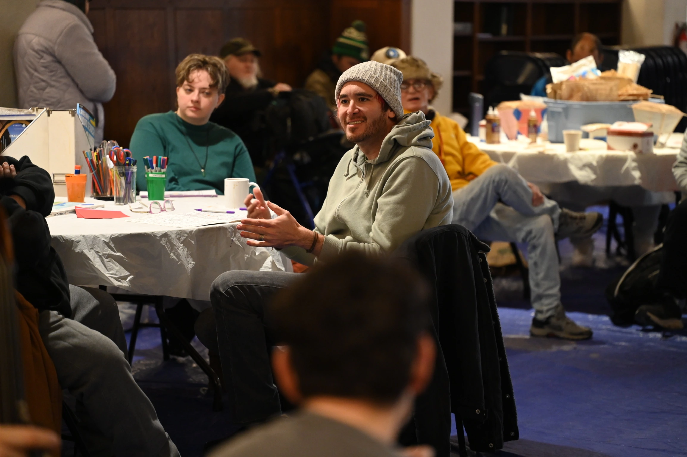 People gather in an open forum discussion