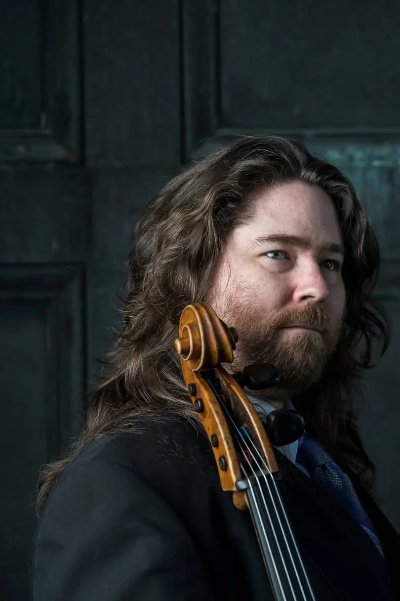 A headshot of a cellist