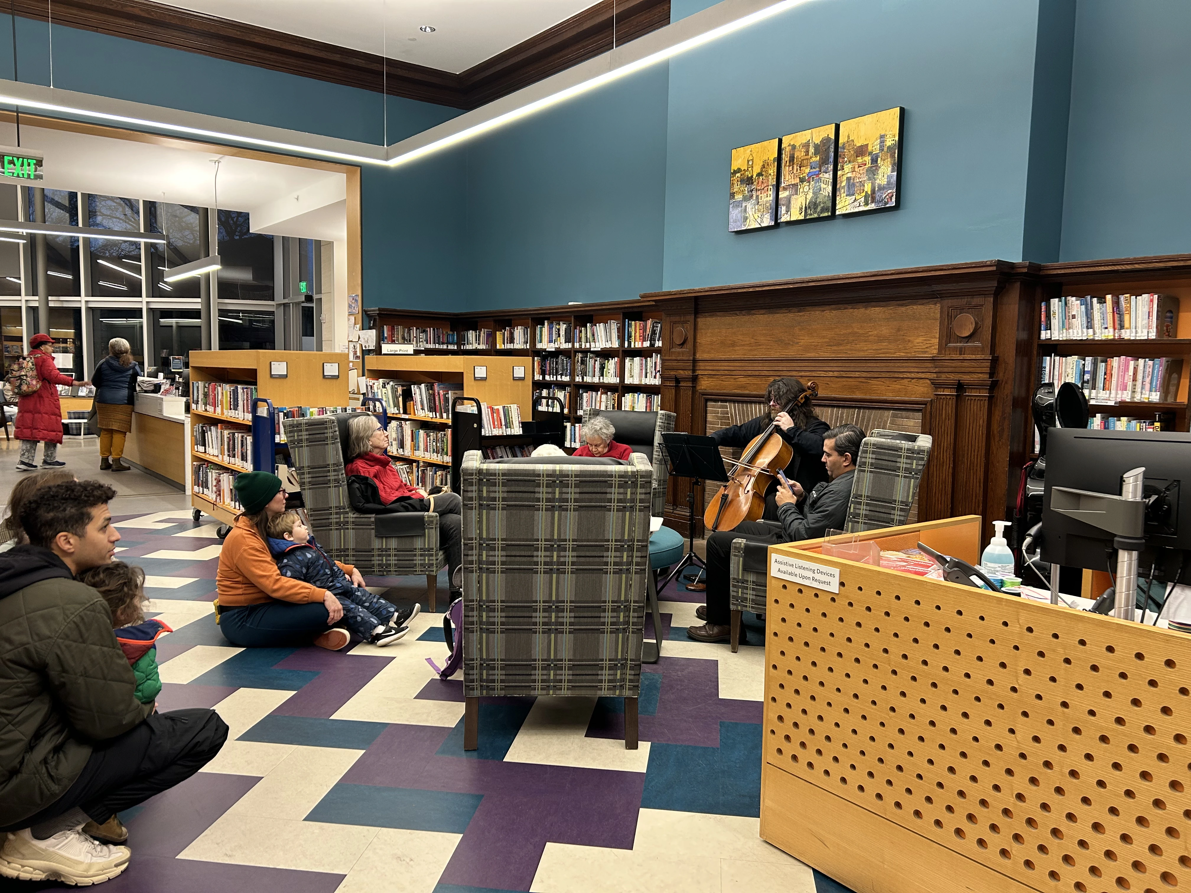 A cellist performs in a library