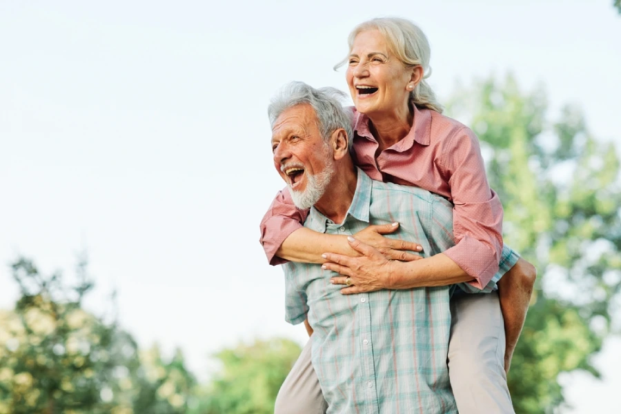 Happy active senior couple having fun outdoors