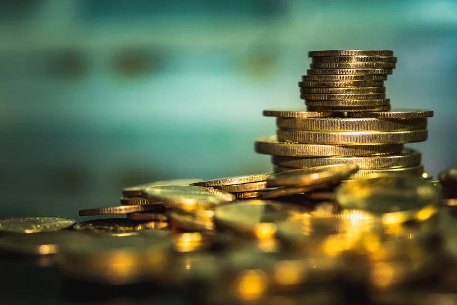 Gold coins stacks is representing riches and wealth management.