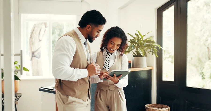 Employees reading from tablet