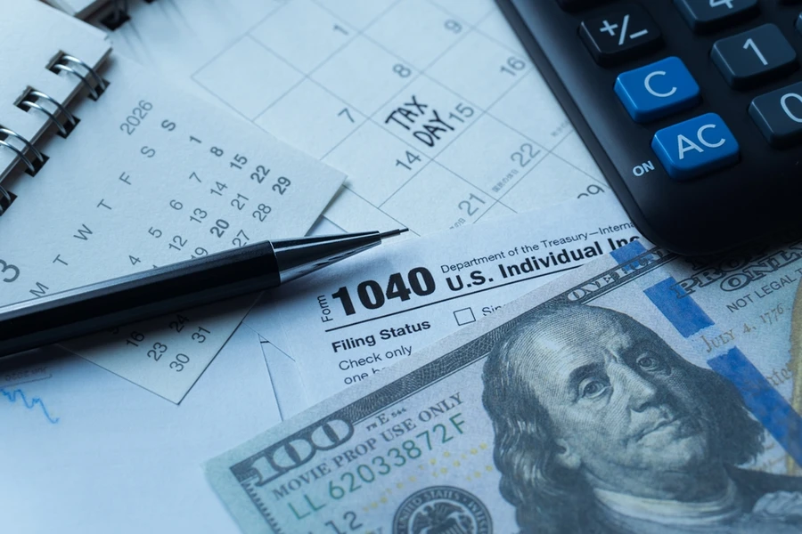 Wincome tax form with bills and calculator
