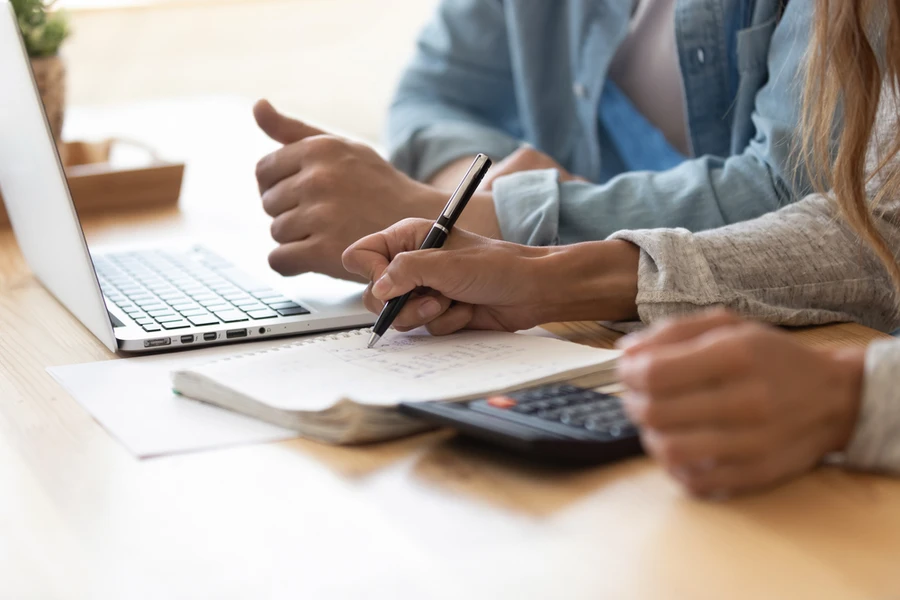 Close up of hands reviewing financial information