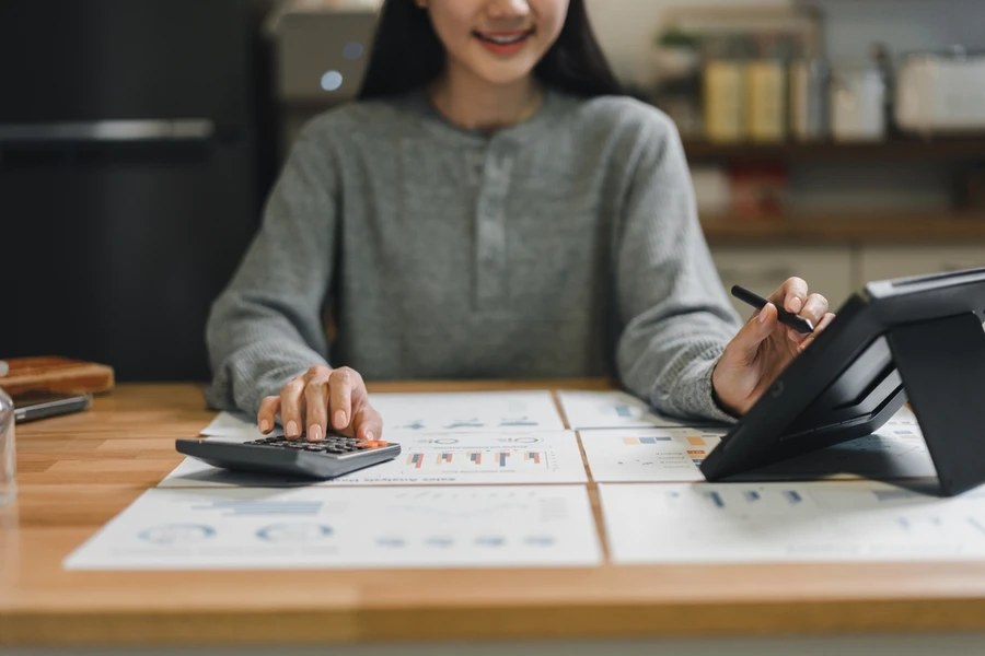 Woman is working on financial reports and data analysis