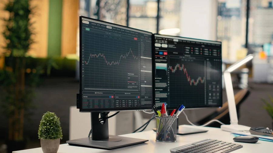 Computer showing software and stock metrics