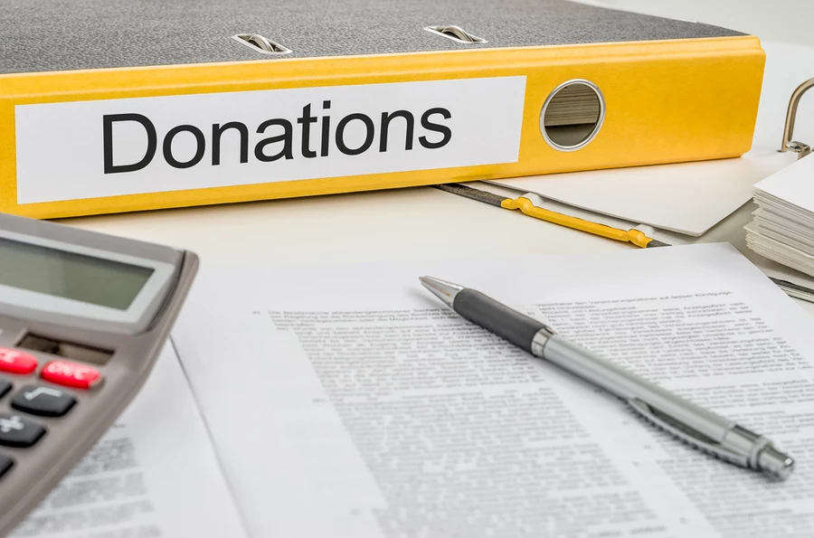 Yellow binder labelled Donations