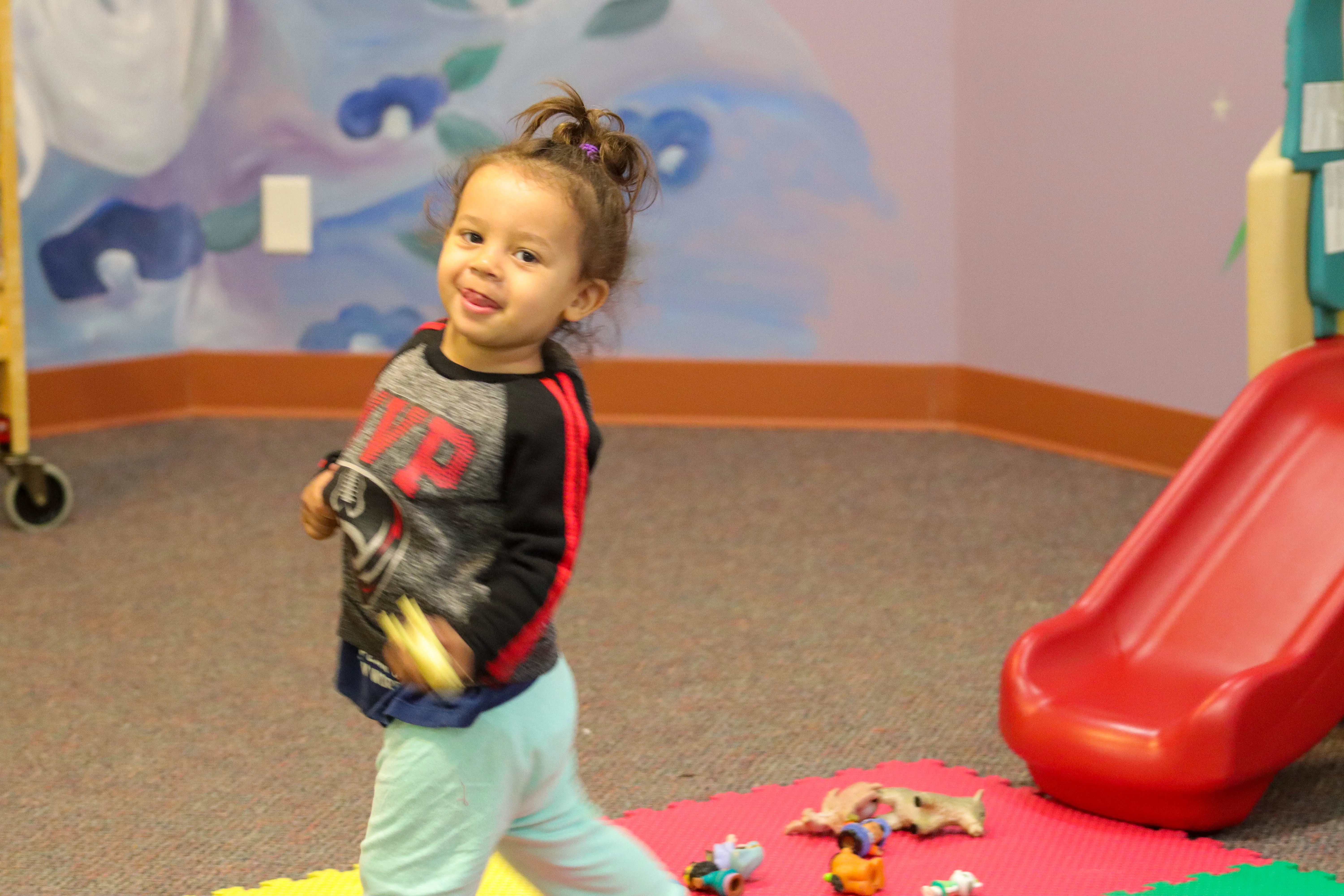 image of a little girl playing in nursery at reach church facility