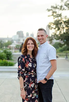 Pastor Cullen and his wife Shelley posing in the parking lot of Reach Church.