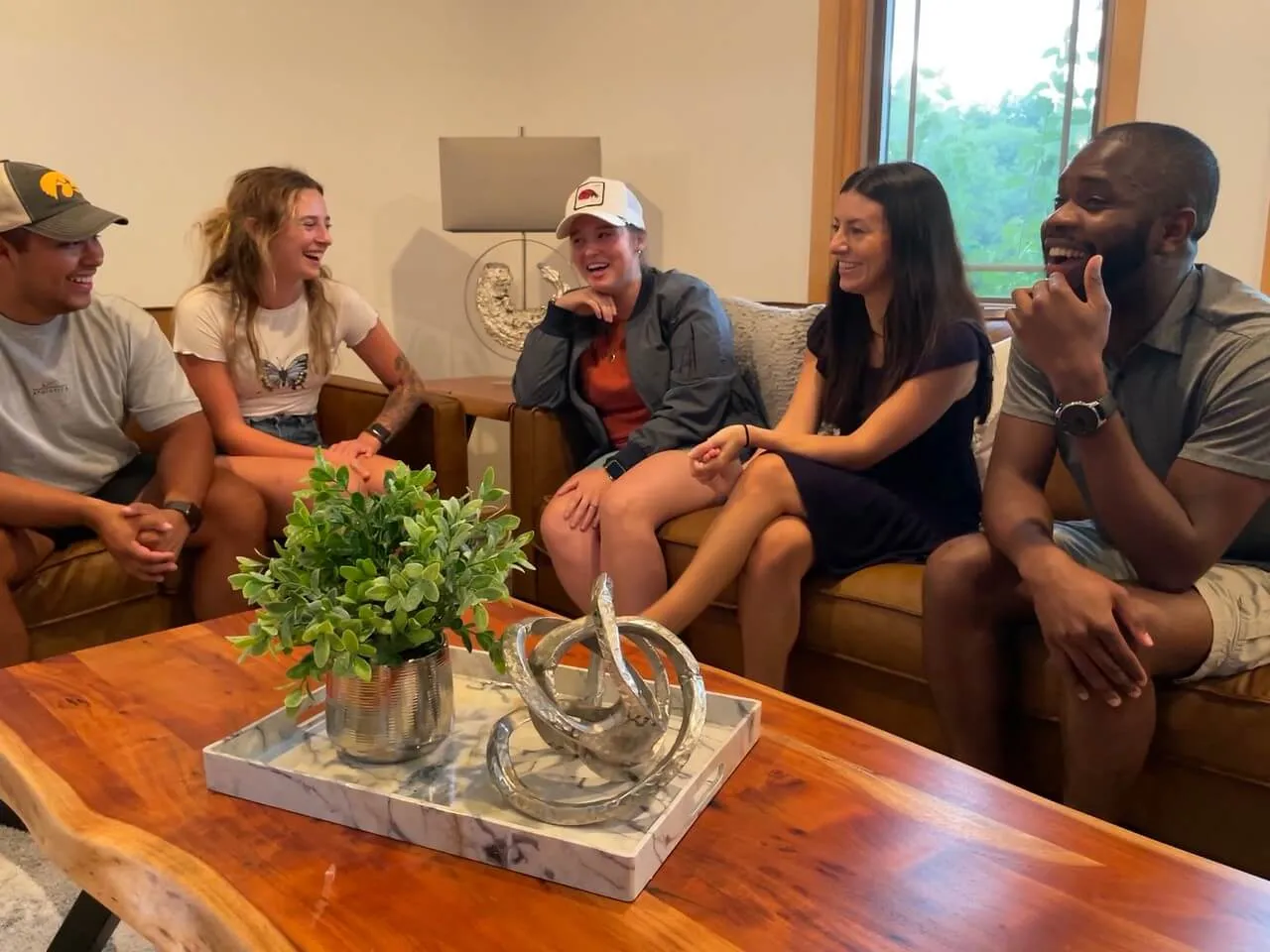 an image of people having a casual conversation at reach church facility